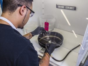 worker cleaning components